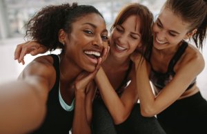 Smiling women in workout clothing