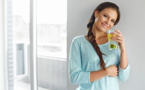 Woman drinking lemon water