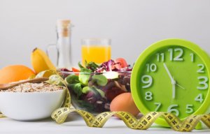The meaning of eating healthy: Clock and measuring tape.