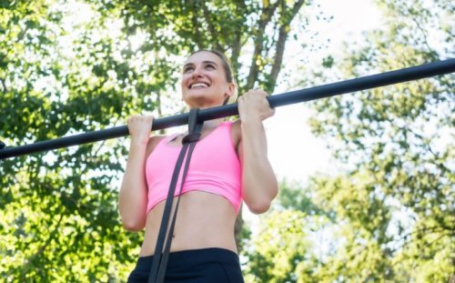 woman doing full pull-ups with band