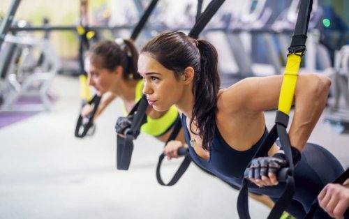 women using TRX bands