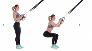 Woman doing TRX squat