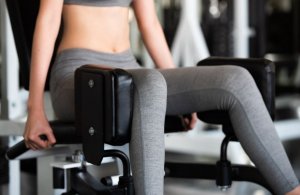 Woman using exercise machine