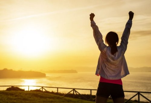 Girl working out with her arms in the air