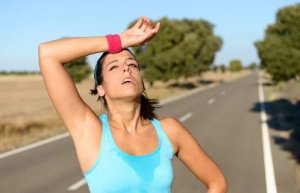 Lactic acid effect. Woman after running.