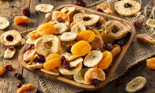 variety of dried fruit in a wooden bowl