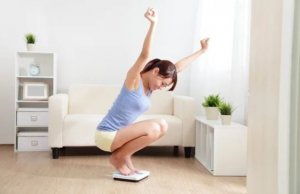 Woman on a scale after consuming fiber.