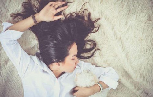 girl sleeping with dog