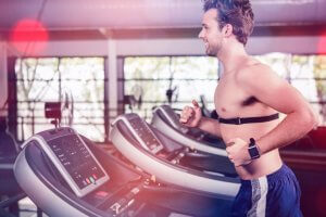 Man checking heart rate with elastic band.