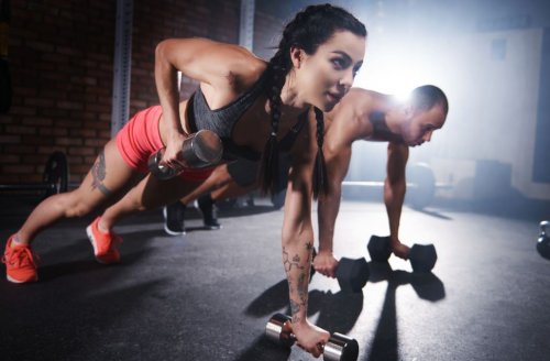 man and woman doing plank with tricep extension