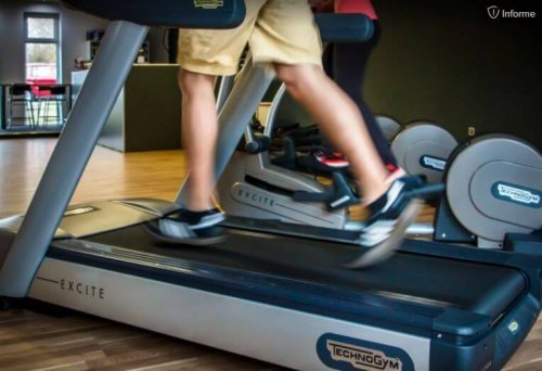 man's legs on a treadmill running outdoors or at the gym
