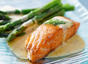 Salmon with wild asparagus for fish dinner.