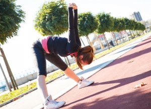 Woman stretching outdoors.