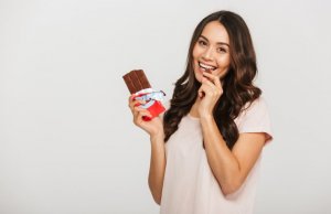 Woman eating chocolate