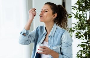 Woman eating yogurt
