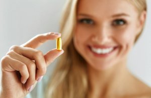 Woman holding Omega 3