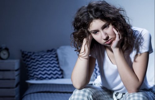 woman tired bedroom