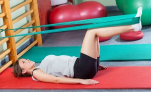 Woman using exercise band