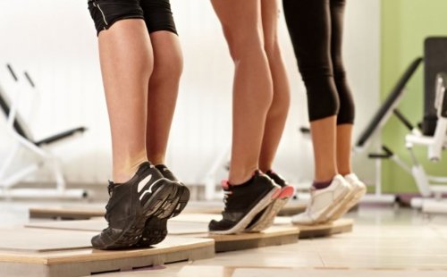 women's legs doing calf raises at gym