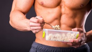 Healthy man eating rice.