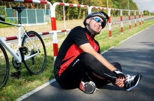 Rider suffering from cycling injuries.