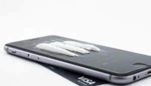 Phone with cocaine lines on it.