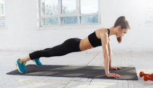 Girl doing push-ups: basic exercises.