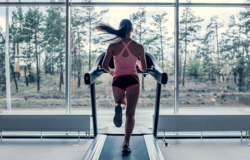 Woman using a treadmill indoors.