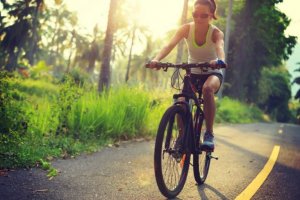 Woman riding a bike.