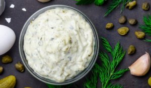A bowl of mustard and dill sauce.