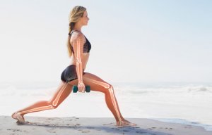 Woman exercising on beach