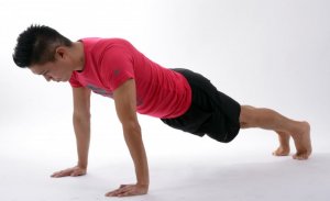 Men doing the plank pose.