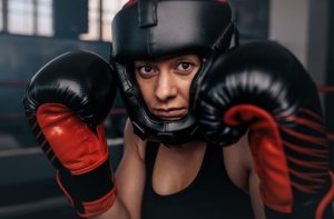 Woman using boxing gloves.