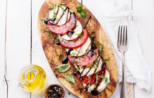 Wooden board with Caprese salad