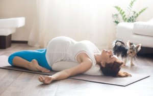 Pregnant woman doing great pilates exercises