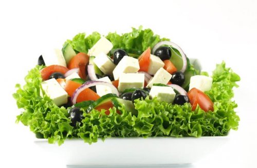 Salad with cheese, olives, tomatoes, lettuce