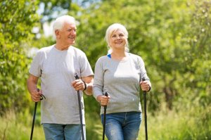 Senior couple practising snowshoeing.