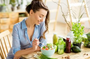 Woman eating a salad.