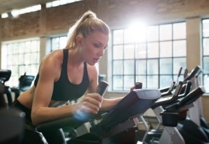 Woman at the gym doing spinning