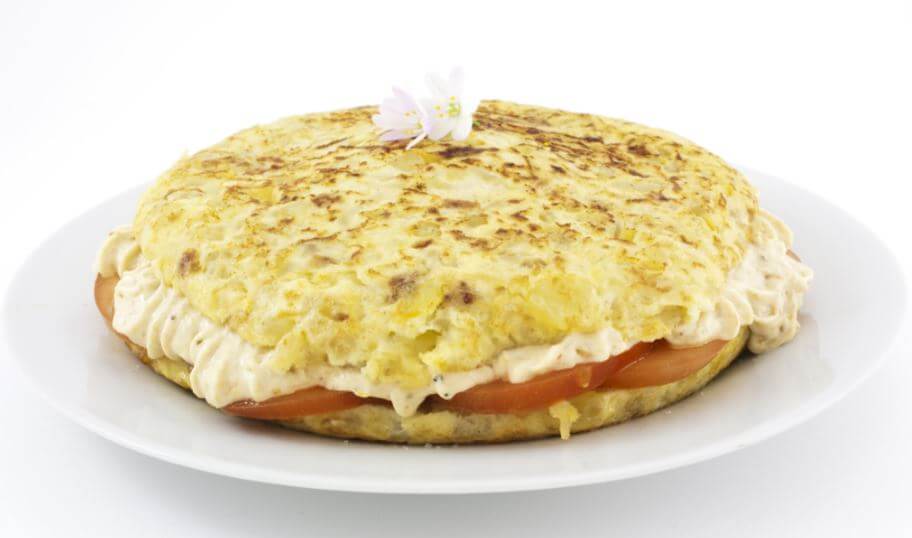 Potato omelette stuffed with cheese and tomato