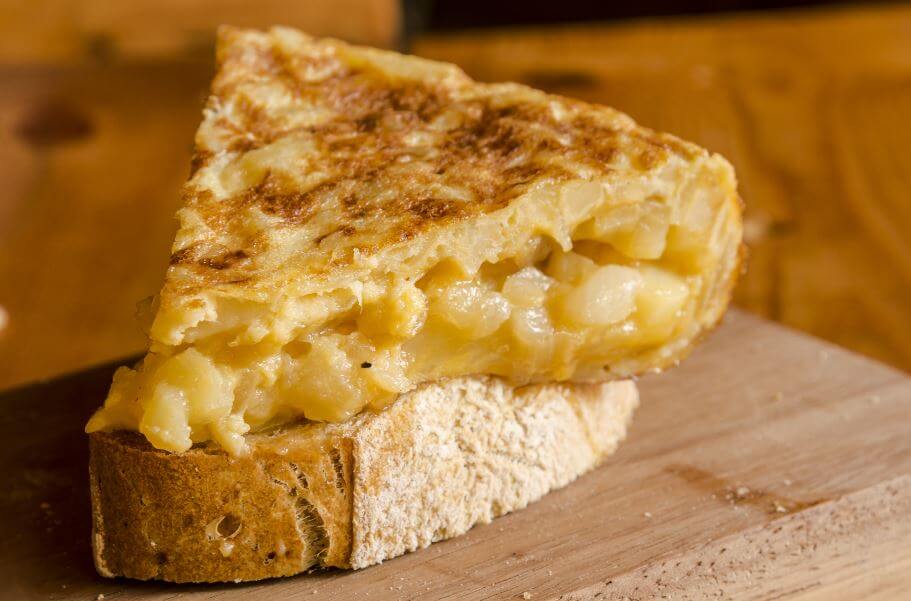 Slice of freshly cooked potato omelette