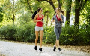 Two women running outside