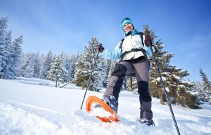 Woman practising snowshoeing.