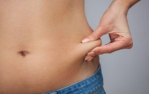 Woman pinching belly