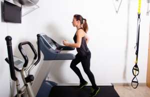 Woman running on a treadmill.