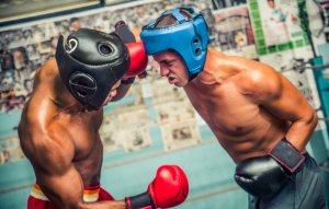 Two guys boxing.