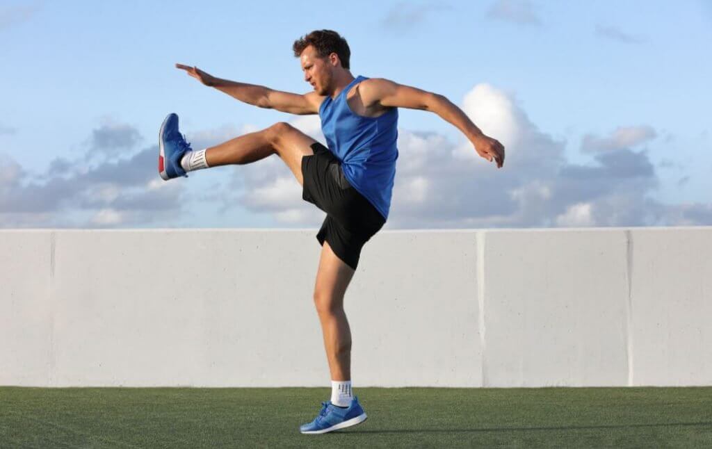 boy doing leg stretches