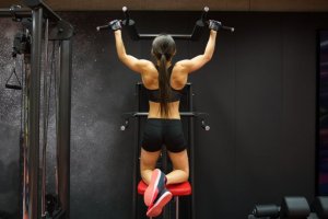 Woman doing pull-ups.