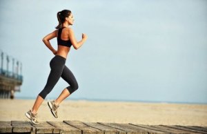 Woman running on the beach.