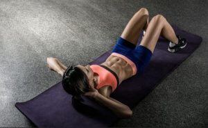 Girl working her abs with pyramid training